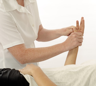 Kinesiologist or physiotherapist treating hand opponens pollicis